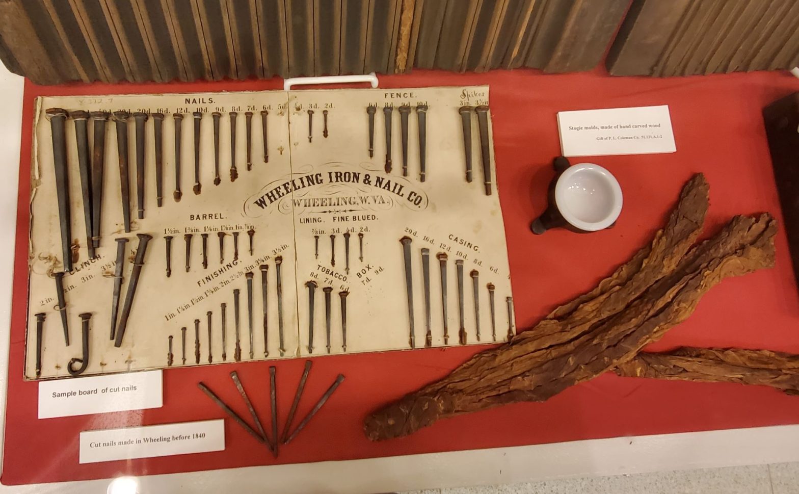 iron nails on a table, red table clother